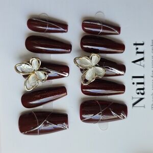 Elegant Burgundy Nail Art with Butterfly Accents